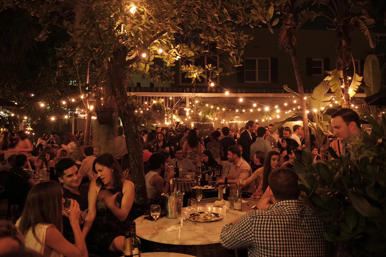 Lagniappe's candlelit backyard with string lights